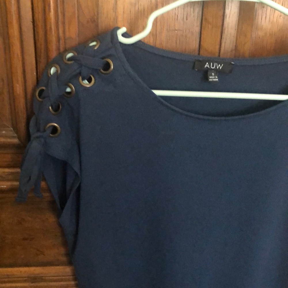 Dark teal shirt with lace details on shoulders